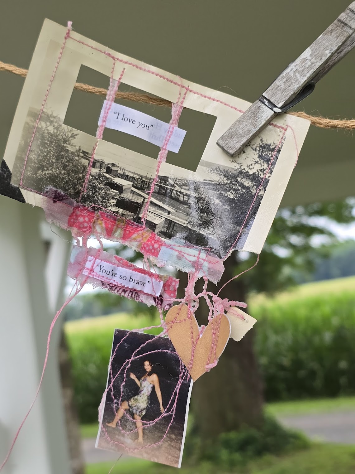 mixed media art hanging on clothesline